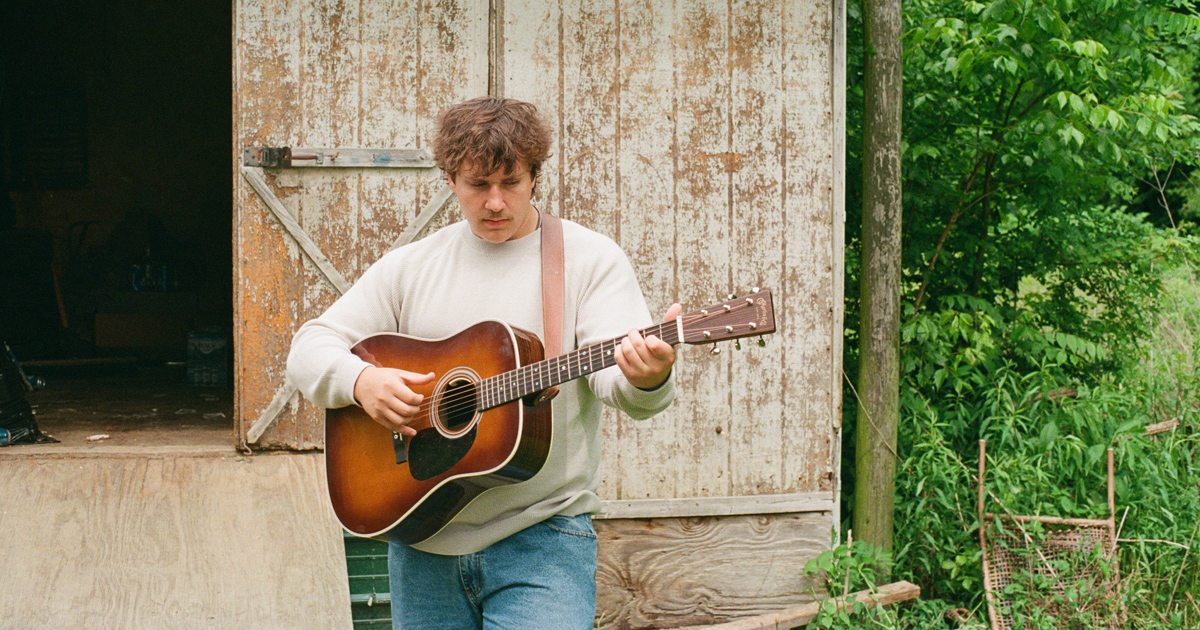 Joshua Sloane with guitar