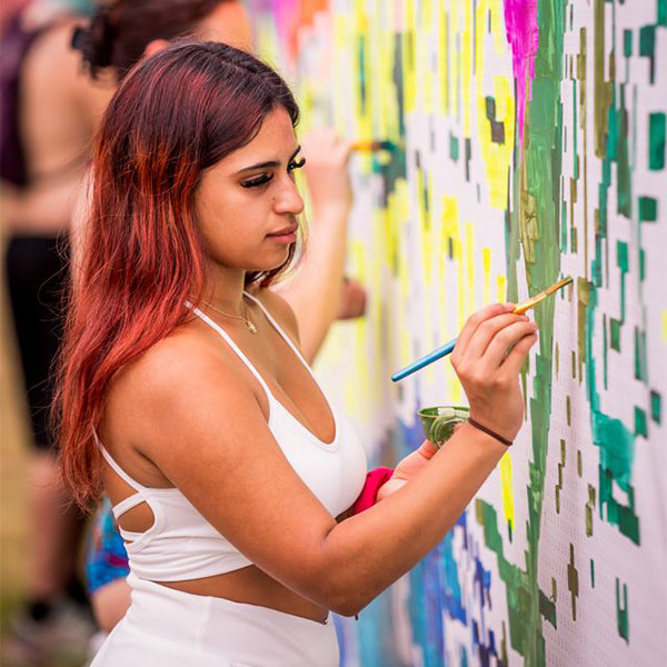 Girl writing on wall