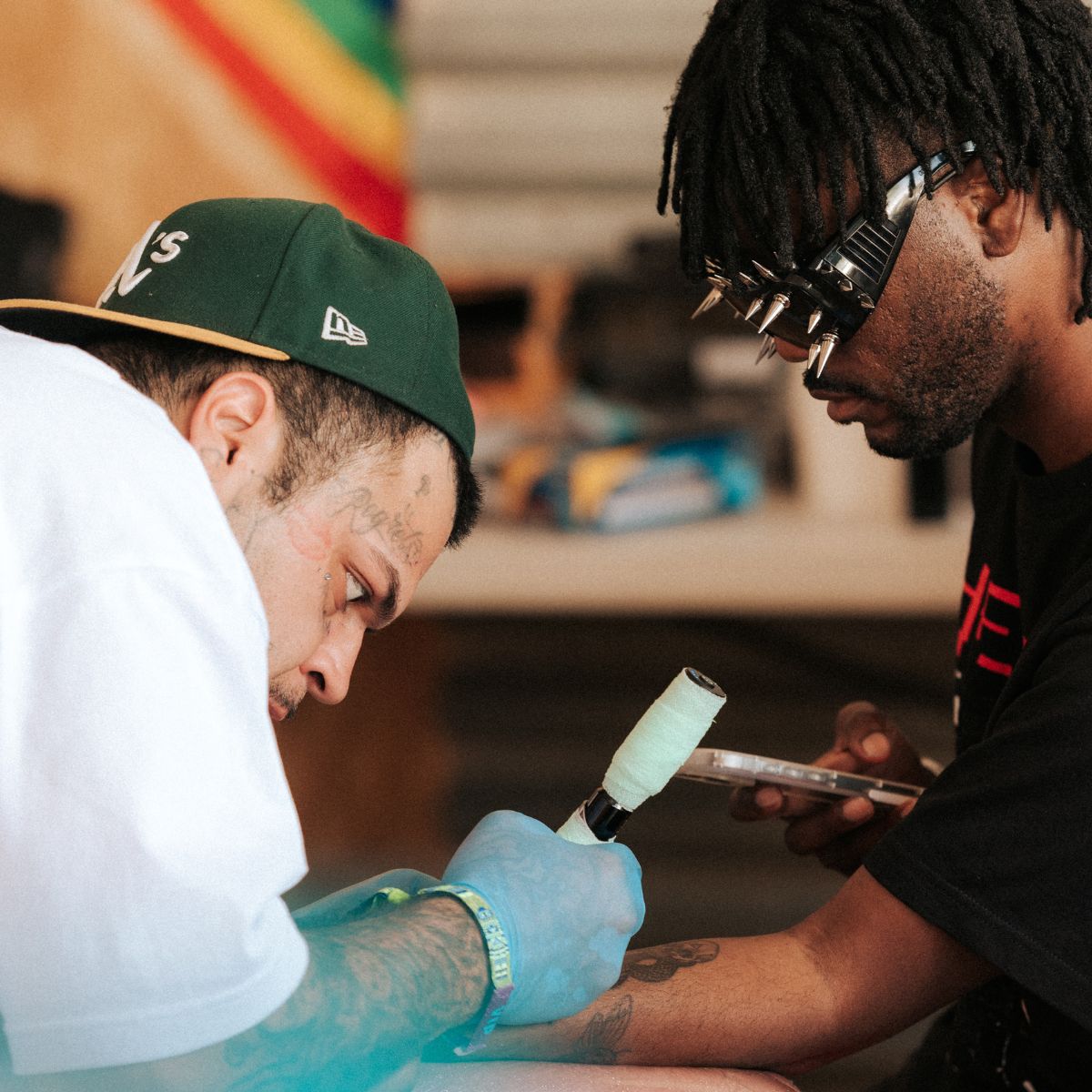 Fan receiving tattoo from artist