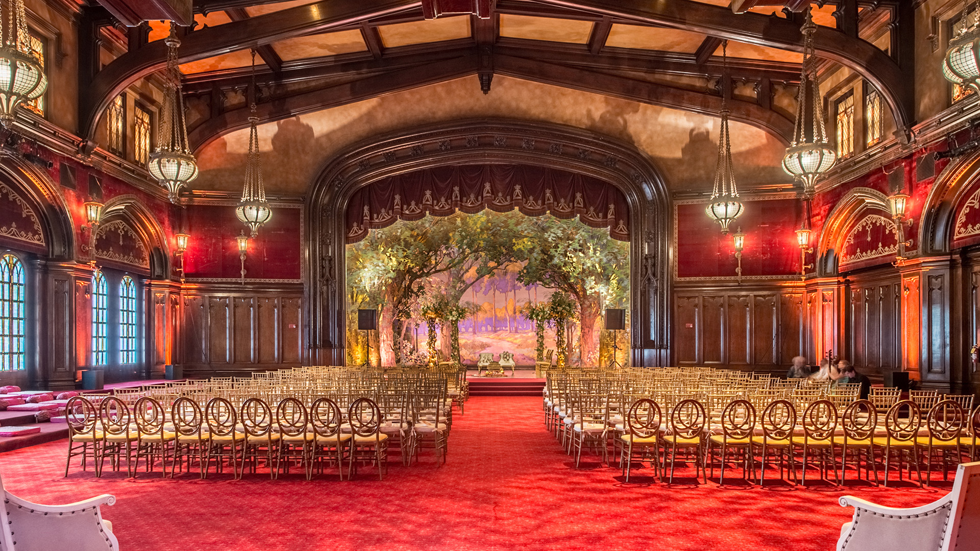 Stage with Red Curtains and Red Carpet