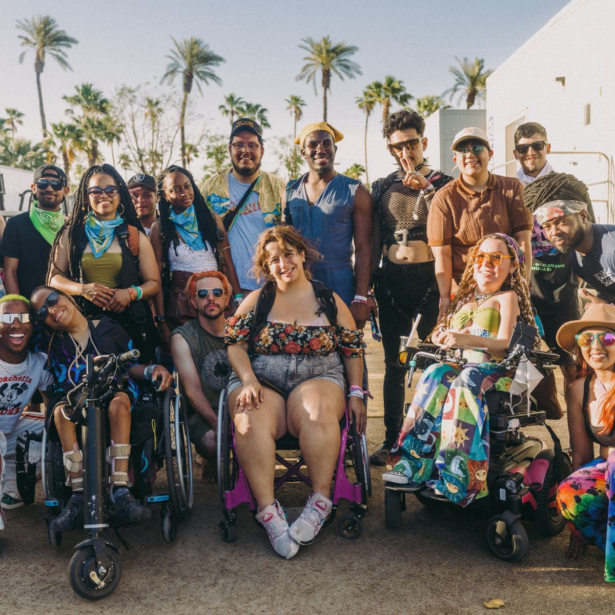 group of festivalgoers, front row in wheel chairs