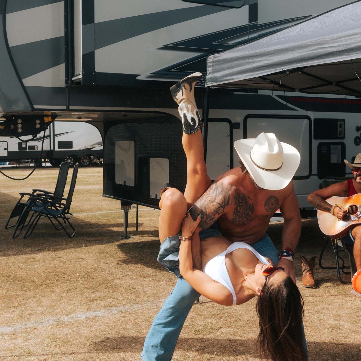 Two people dancing at RV site