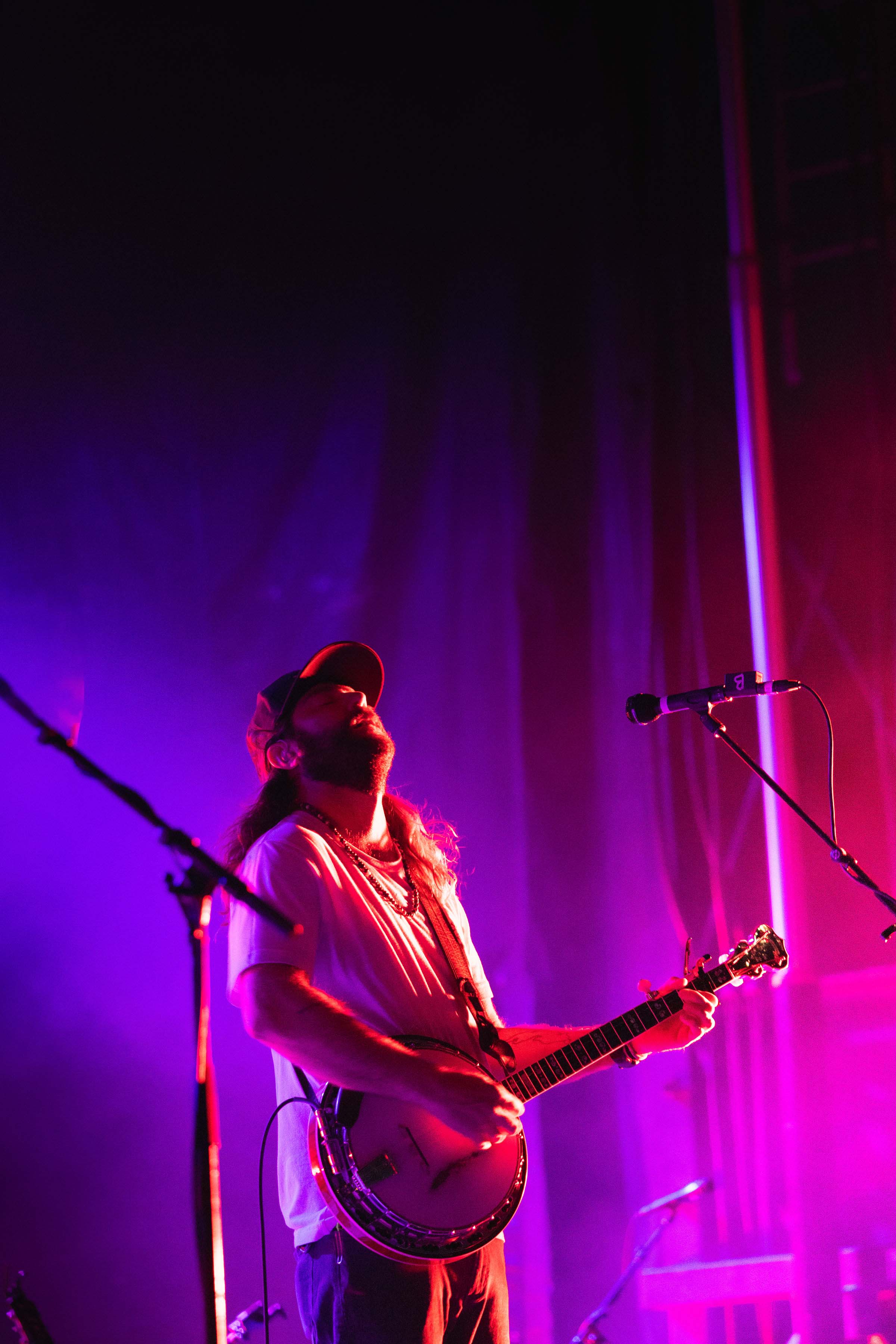 man playing guitar and singing