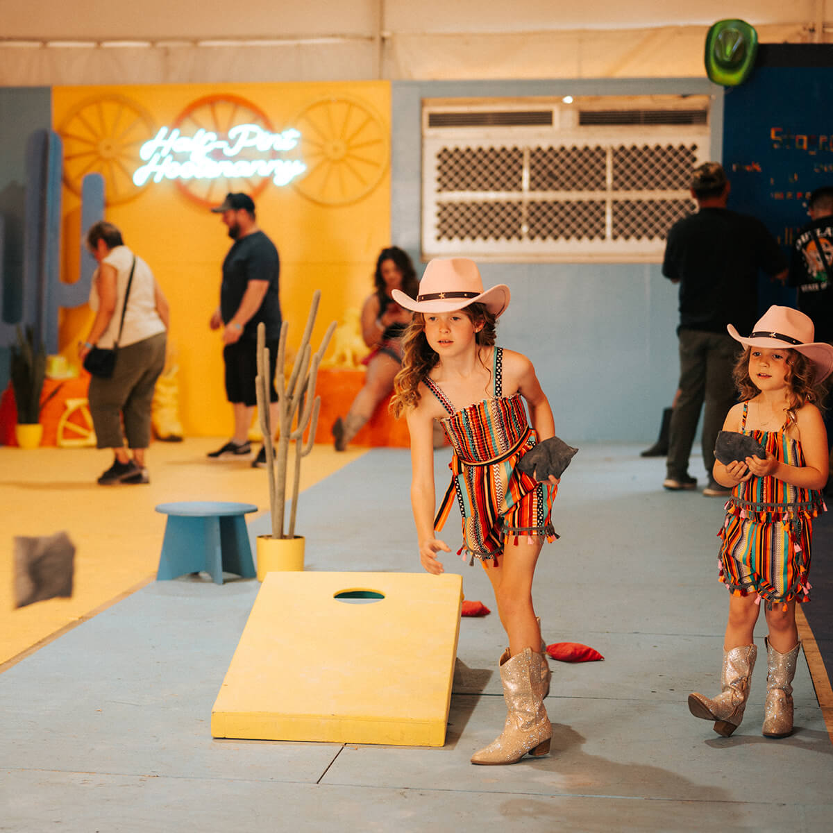 Children playing corn hole