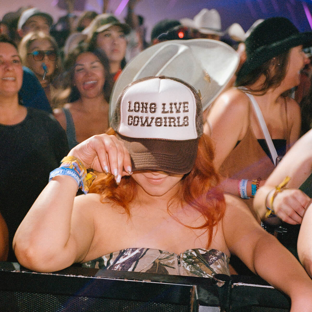 Girl wearing Long Live Cowgirls hat