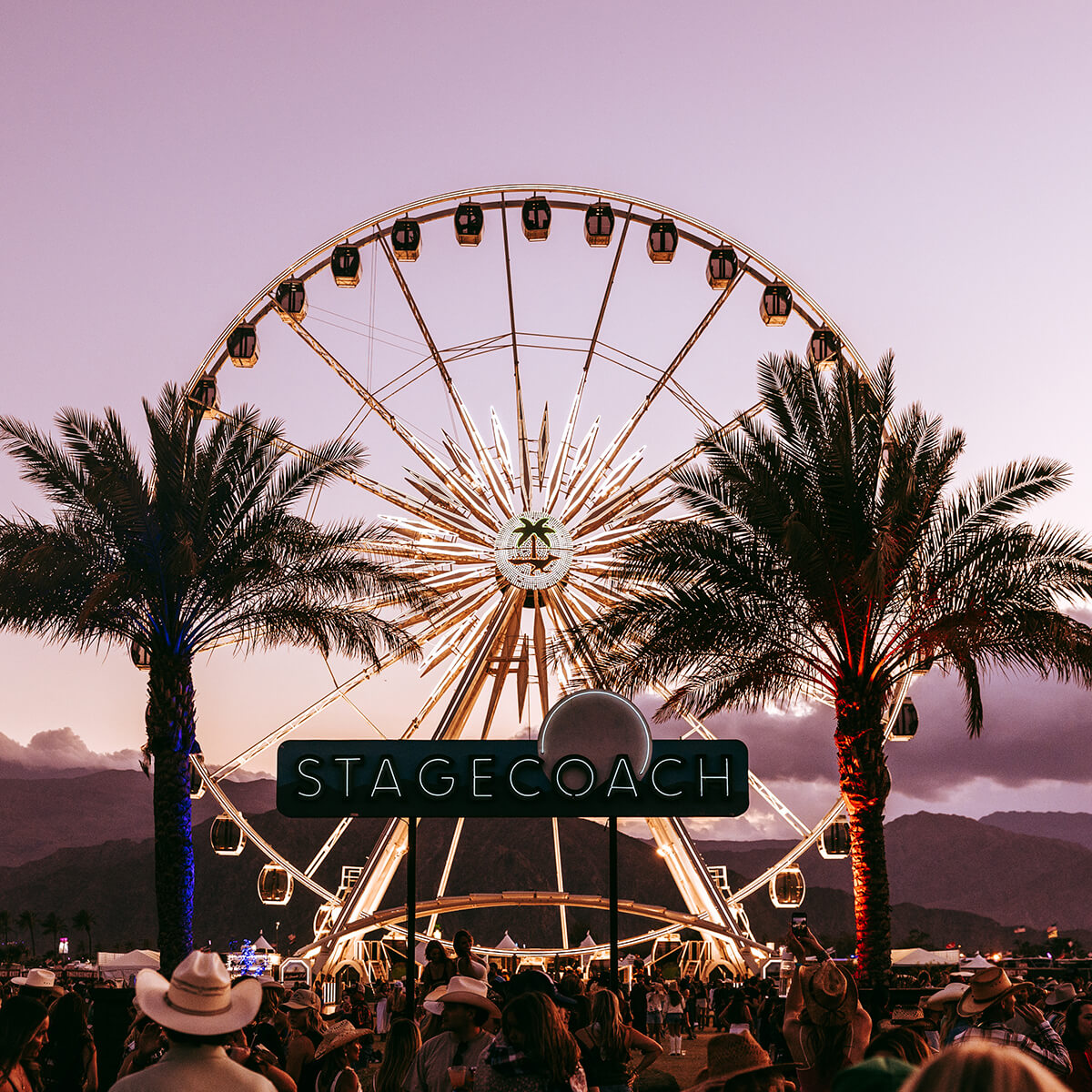 Stagecoach sign and ferris wheel