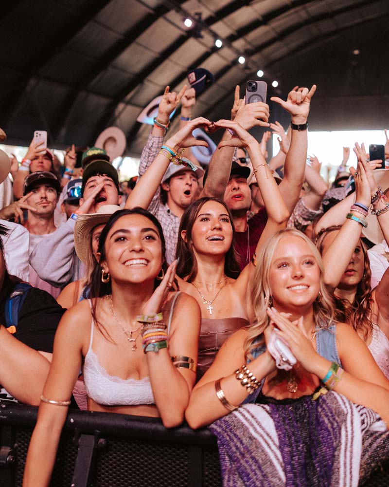 fans at the front of the stage