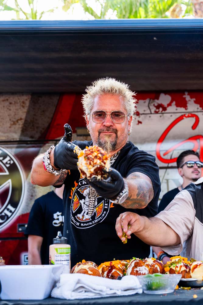 Guy Fieri at the barbecue pit