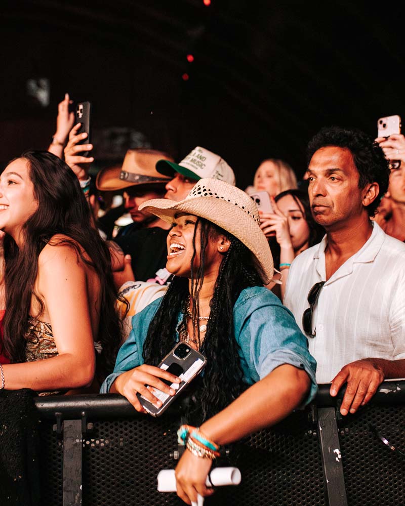 fans at the front of the stage