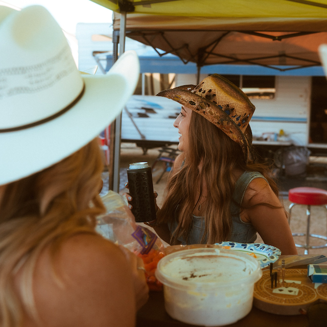 Campers eating at picnic table